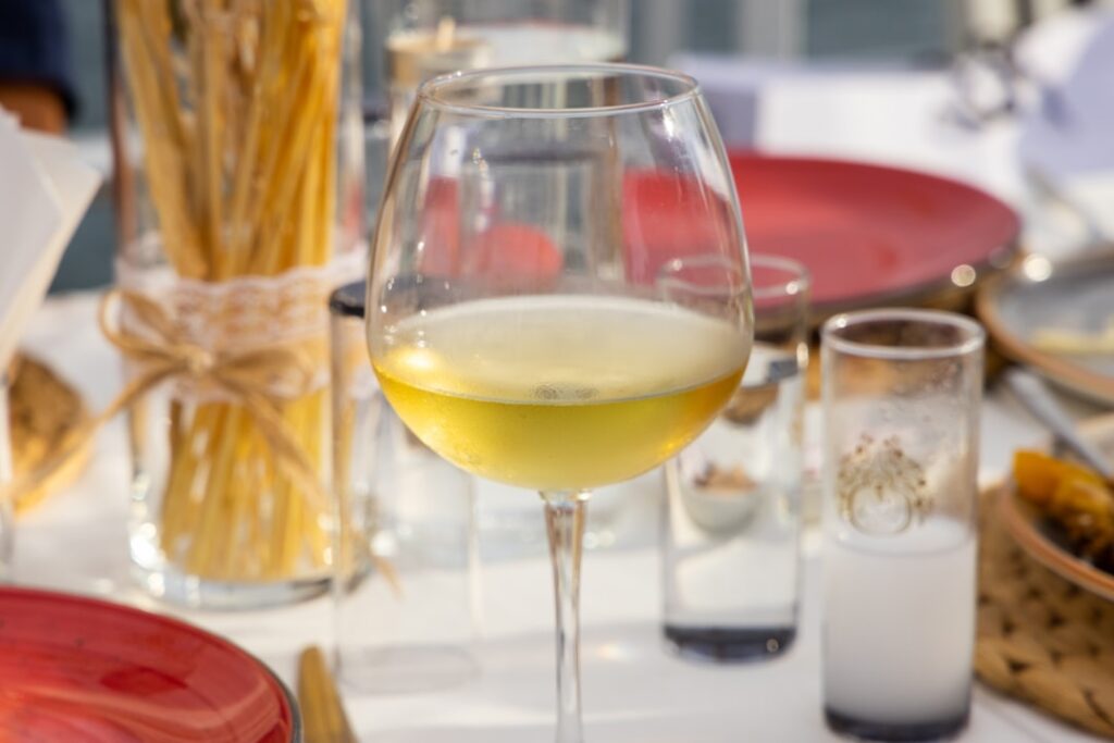 Focaccia ligurian slice cheese wine glass