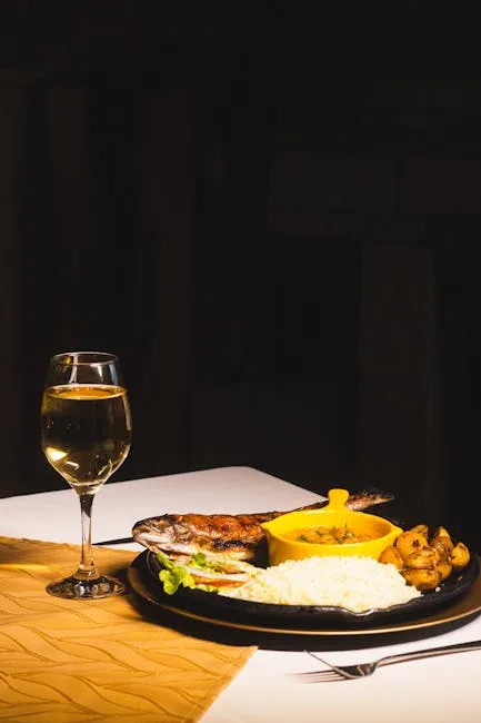 Dans un restaurant des Cinque Terre, plat de poisson grillé avec vin